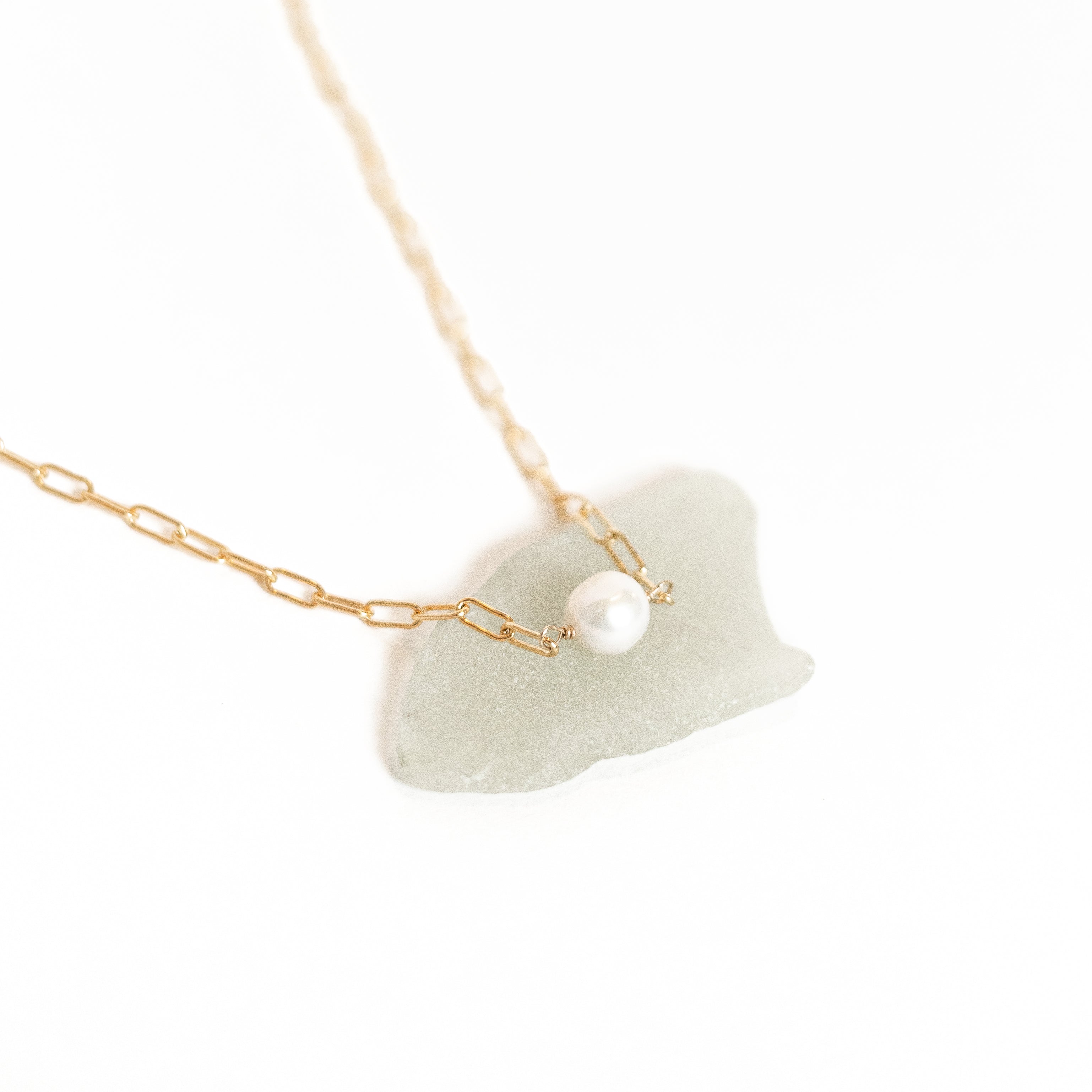 Small pearl wire wrapped onto our gold mini paperclip chain necklace.