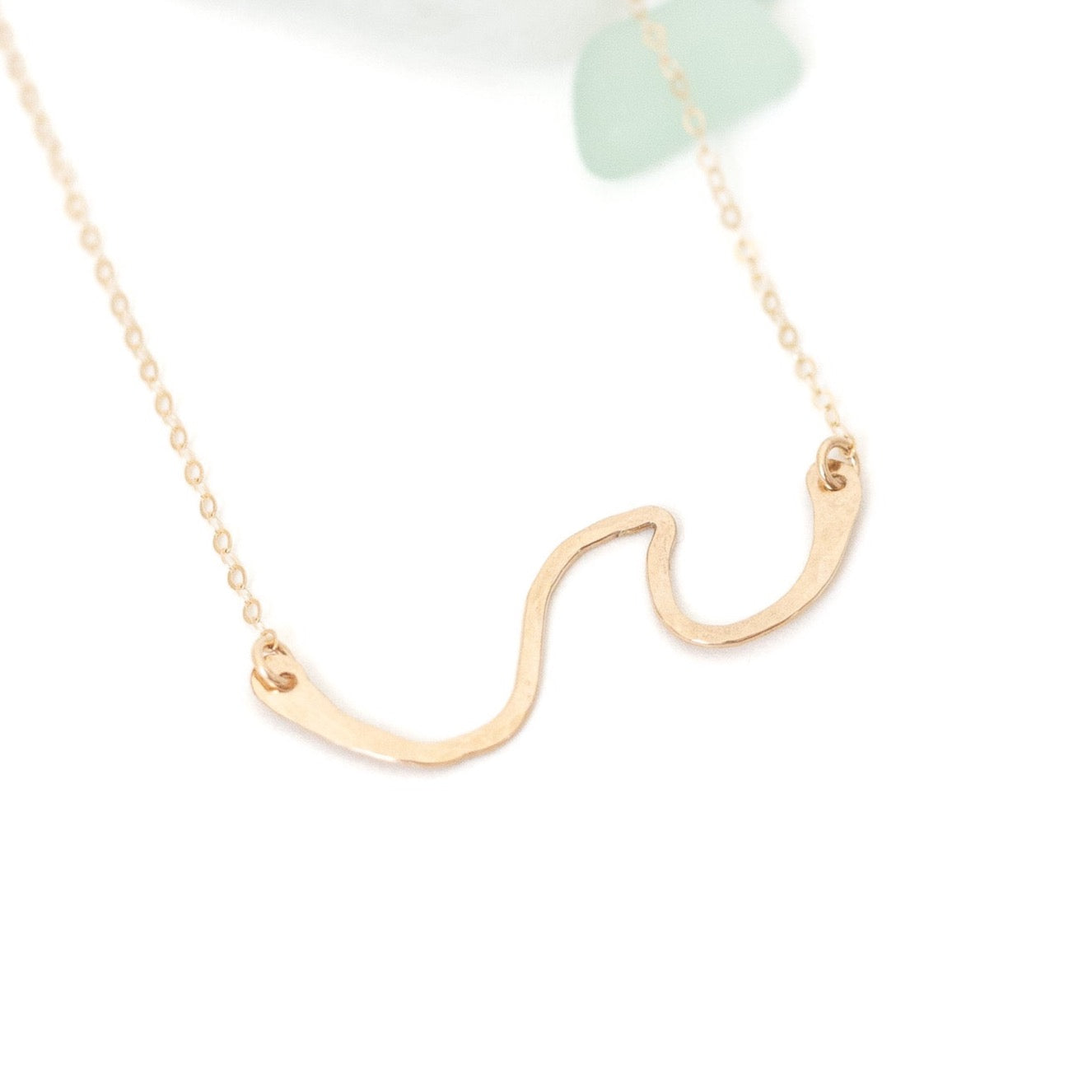 Hand forged gold filled wave with gold wire on a chain.