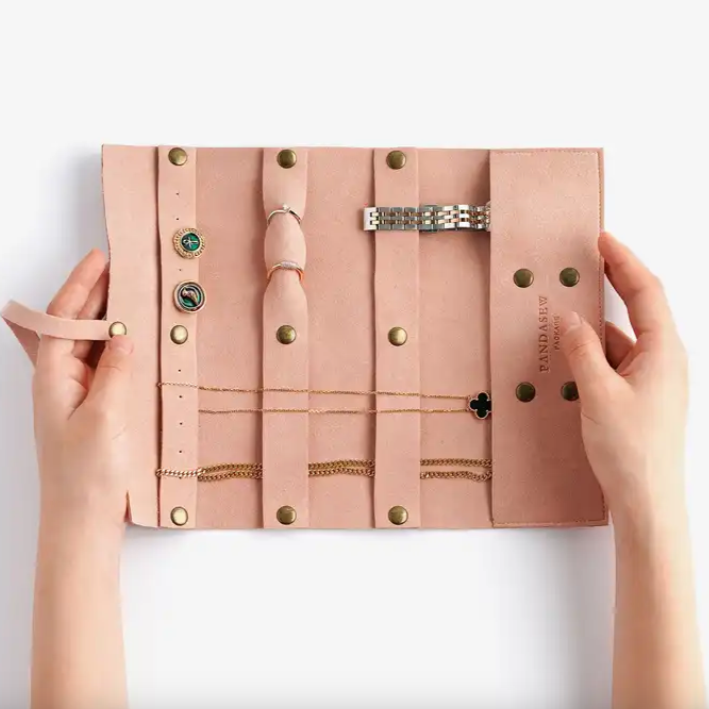 Inside of the pink jewelry travel case.