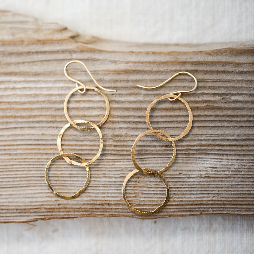 Three gold filled hoop earrings. 