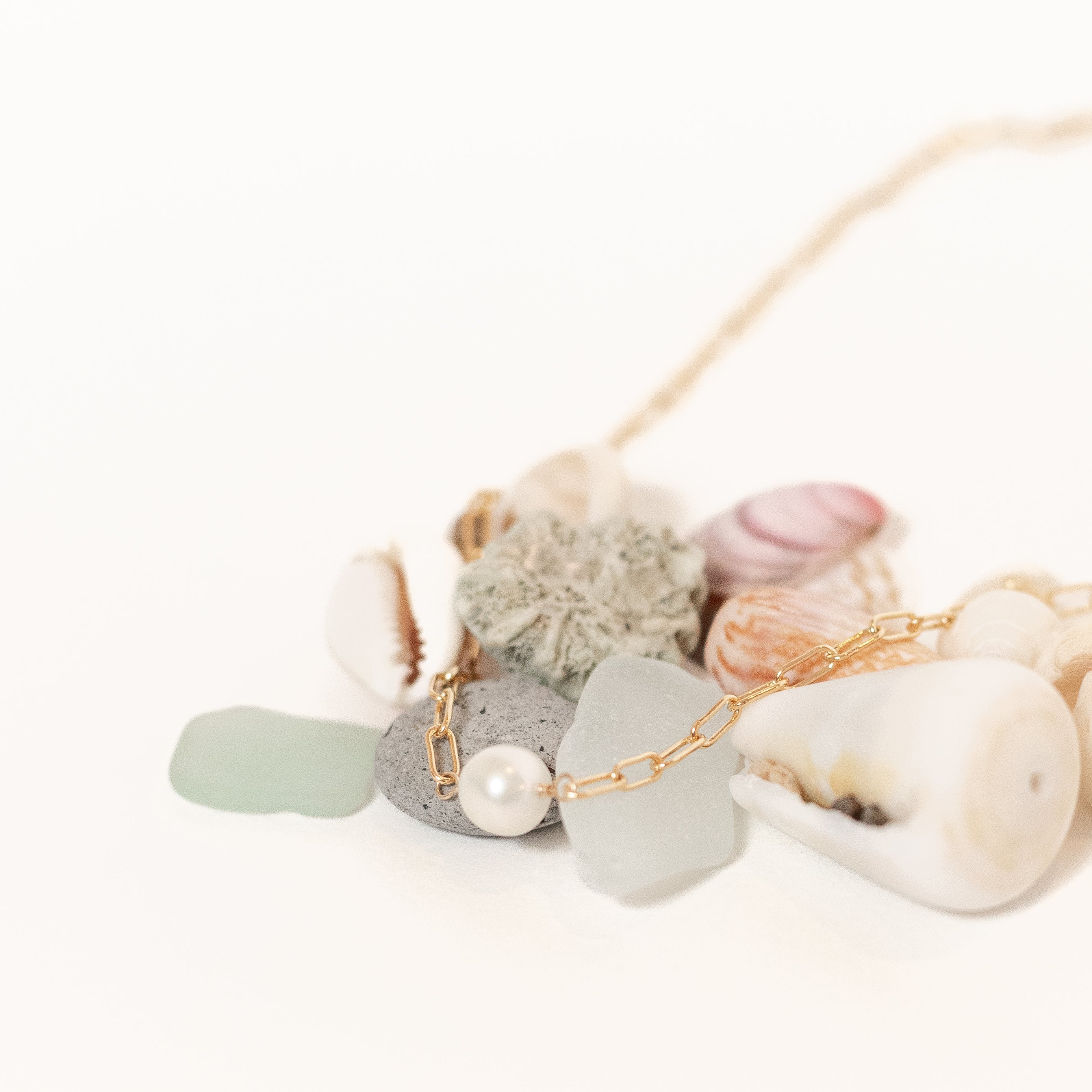 Small pearl wire wrapped onto our mini gold paperclip chain. 