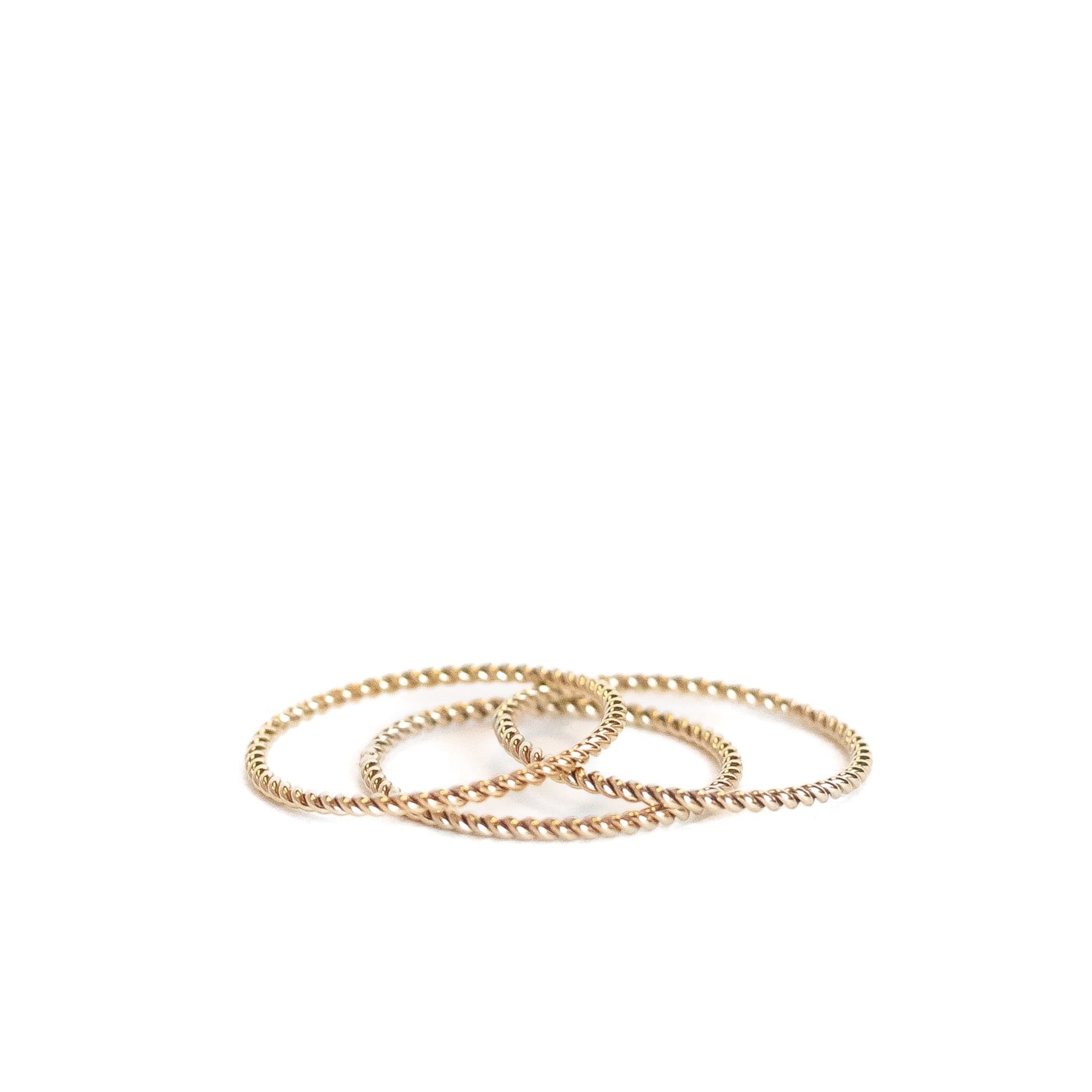 Yellow gold filled twist wire ring. Three shown. 