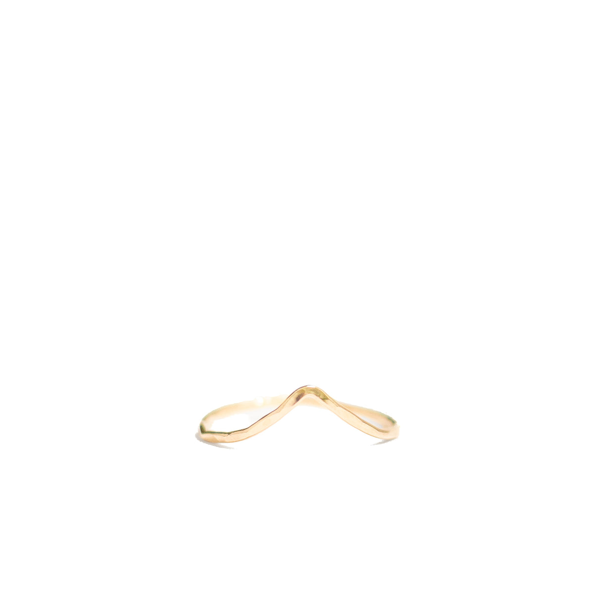 A delicate, thin gold ring with a unique wavy, infinity-like design, photographed on a solid white background.