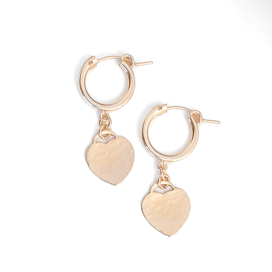 Gold filled hammered heart charm attached to gold hoop earrings 