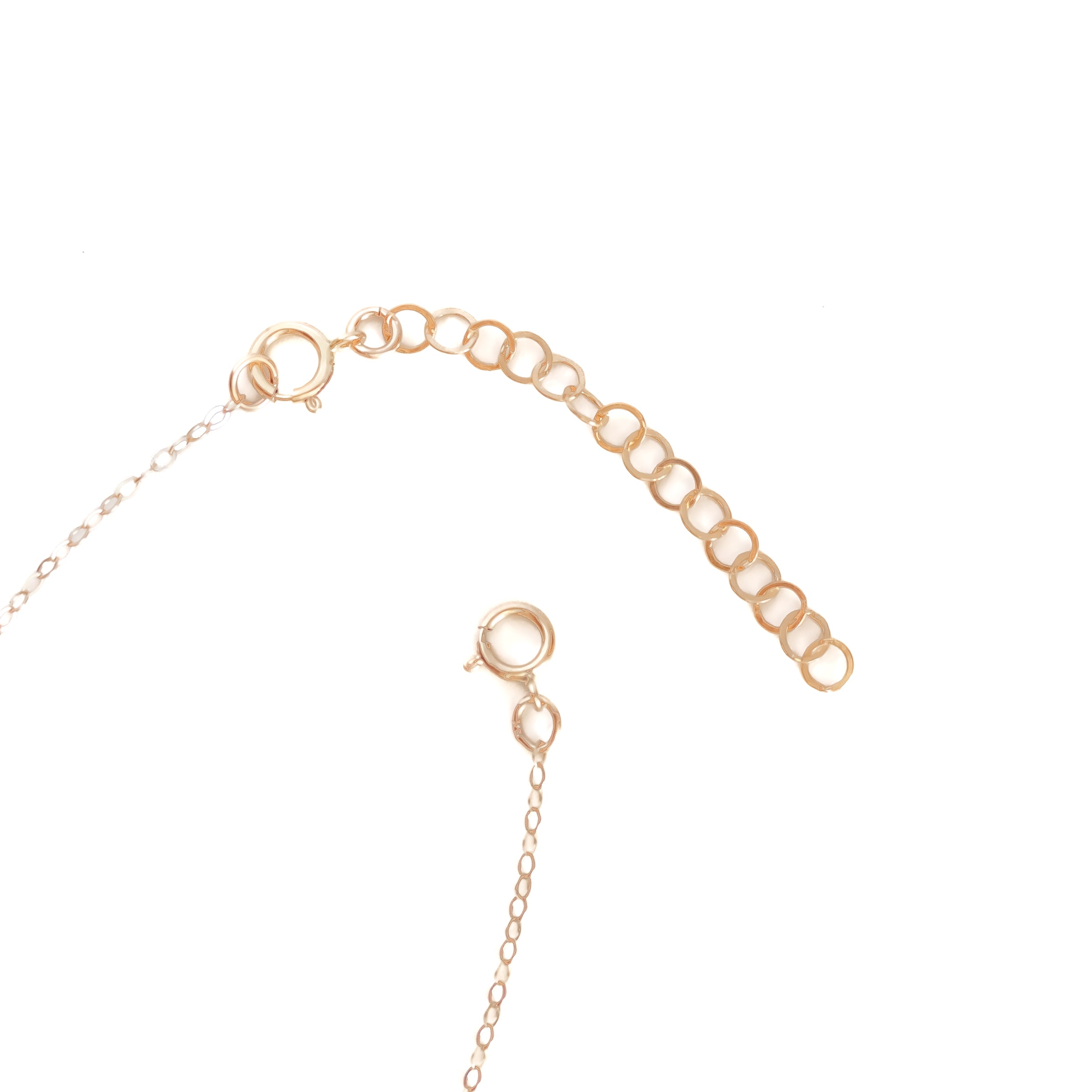 Two inch gold extender attached to our basic gold chain 