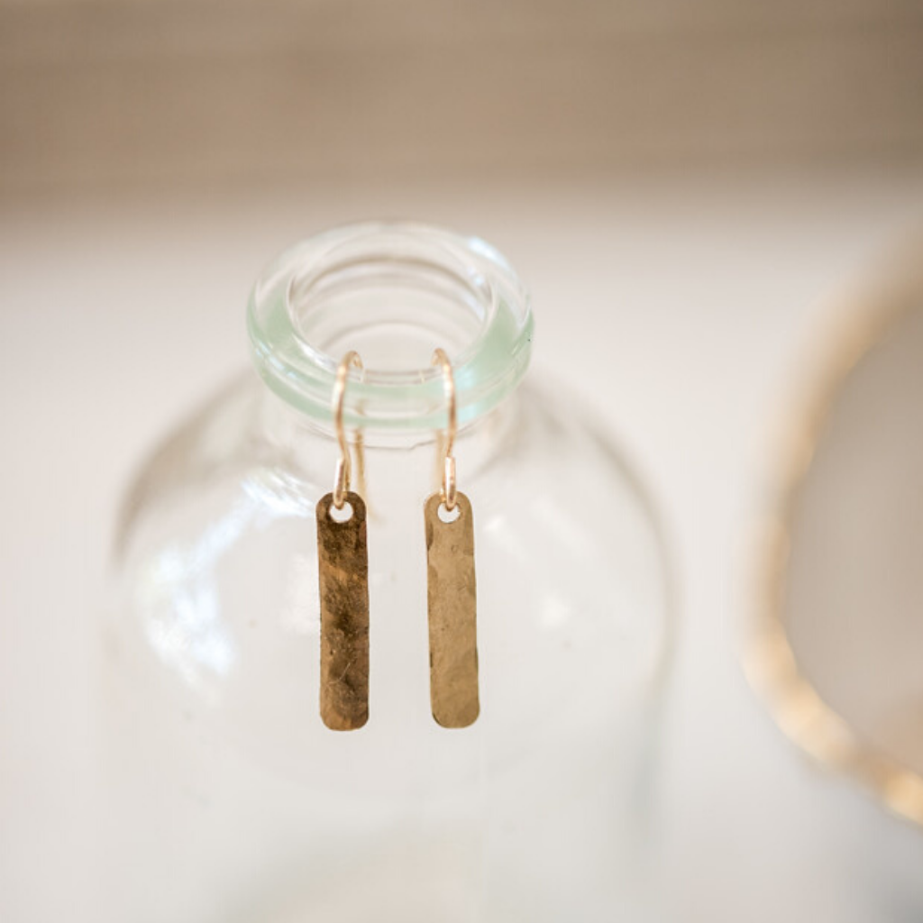 tiny gold filled bars. Hammered and polished they hang about 0.5 inches from the ear.