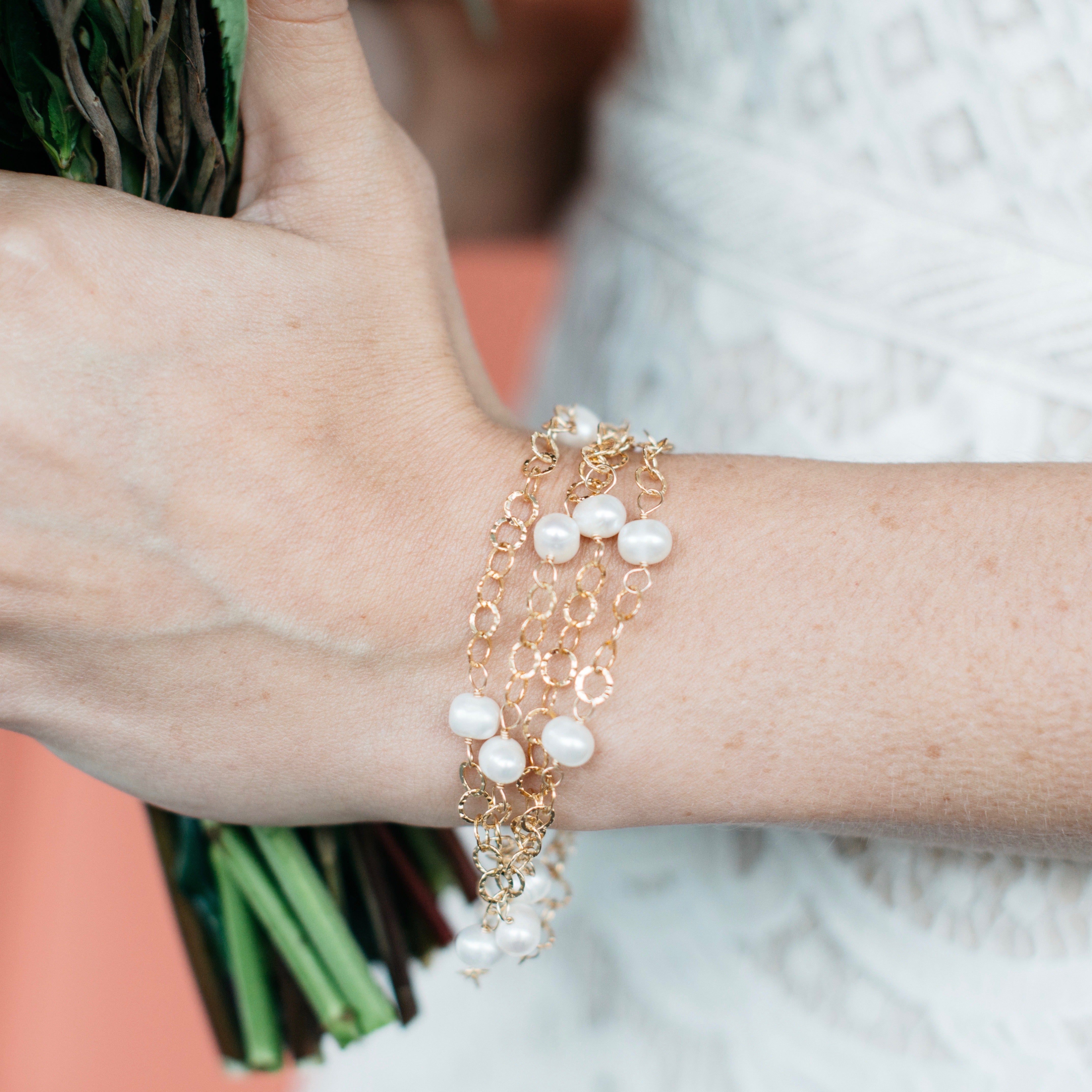 Delicate hammered gold filled chain and freshwater pearl bracelet. Wraps around your wrist four times. 