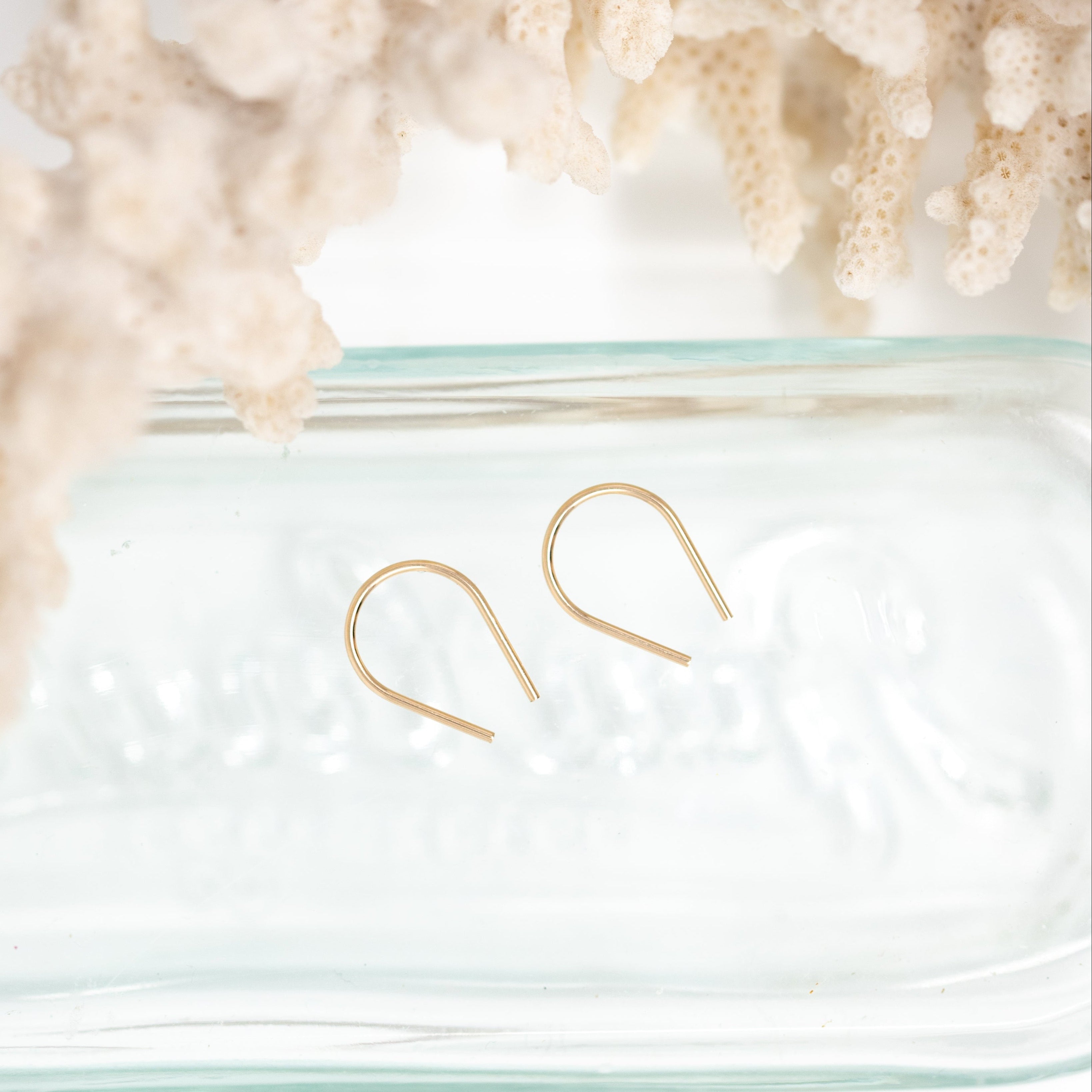 Two Gold filled horseshoe hoops.