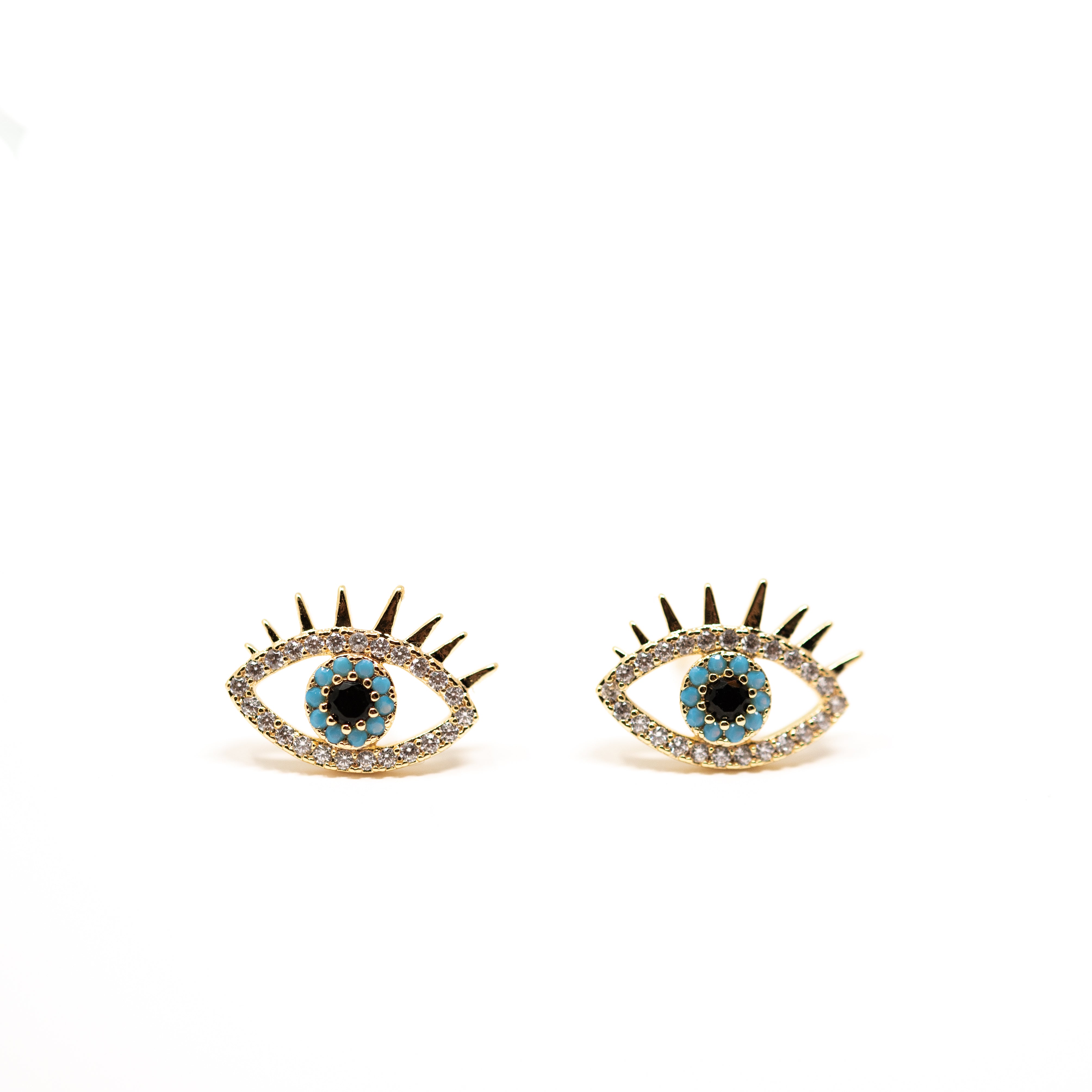 Evil eye stud earrings. Sparkly cubic zirconia and turquoise surrounding the eye. 