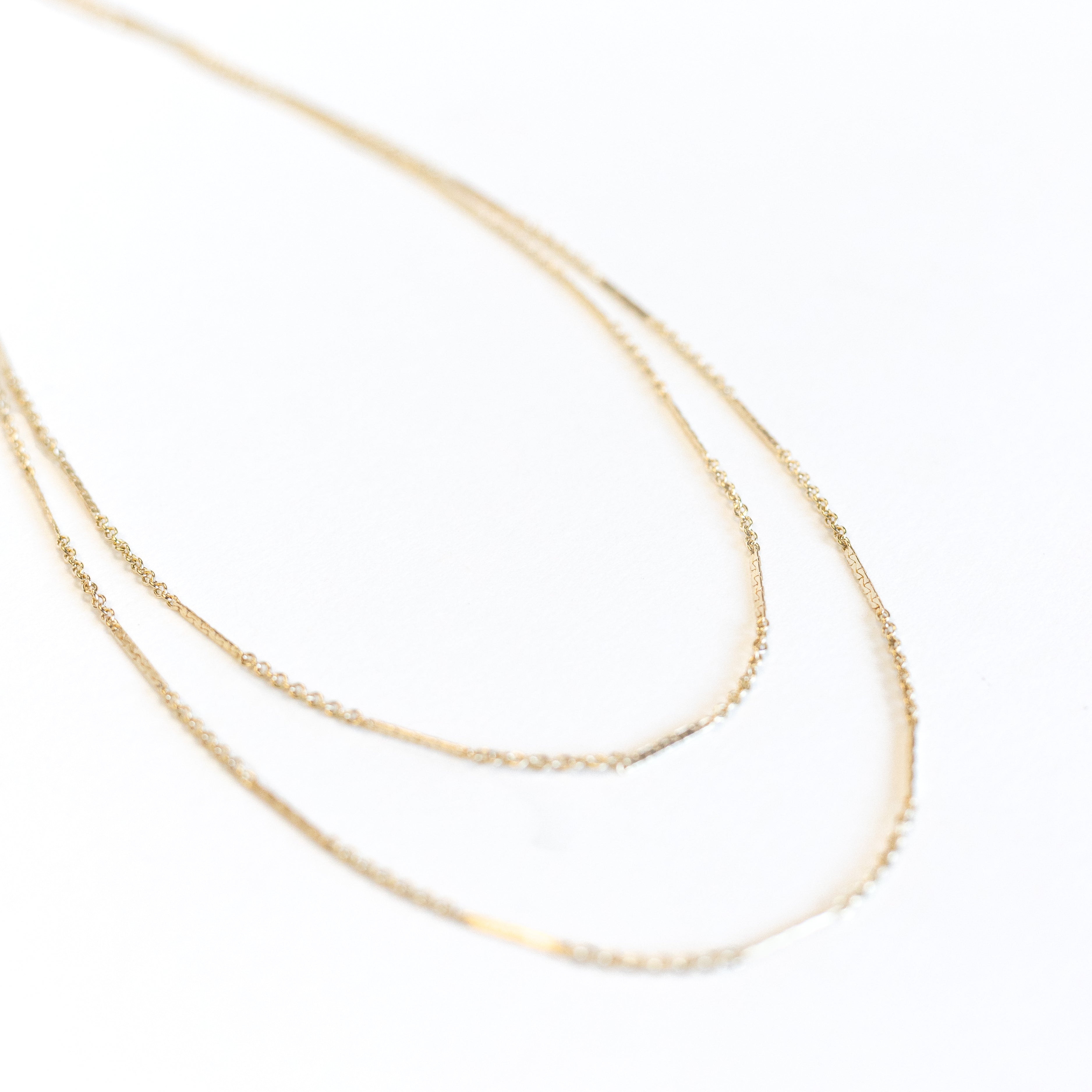 Dainty gold thin necklace that wraps around your neck two times